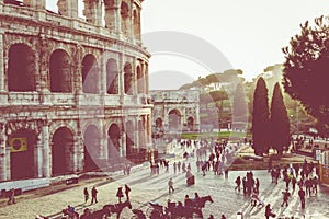 Rome, Italy.One of the most popular travel place in world - Roman Coliseum under evening sun light and sunrise sky. photo