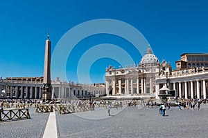 ROME, Italy- 2019: Saint Peter Square Piazza San Pietro Vatican with Obelisk and Tourists against Blue Sky