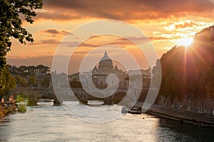 Rome Italy. San Pietro basilica in the Vatican, ponte Sant Angelo and Tiber river, sky at sunset