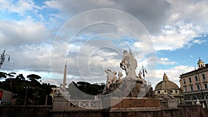 View of the famous Roman square Piazza del Popolo from behind the complex of statues of the Triton