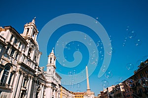 Rome, Italy. Soap Bubbles On Background Of Sant`agnese In Piazza Navona