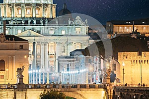Rome, Italy. St. Peter's Square With Papal Basilica Of St. Peter In The Vatican And Aelian Bridge In Evening Night