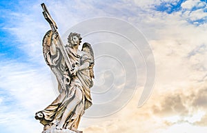 Statue of an Angel with the Cross on Sant'Angelo Bridge in Rome, Italy