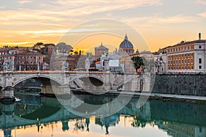 Rome, Italy. Vatican dome of Saint Peter Basilica or San Pietro and Sant`Angelo Bridge over Tiber river