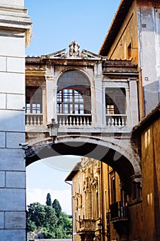 Rome, Italy - A vertical shot of an aged and empty archway next to the Capitoline Museums and hit by the afternoon lights