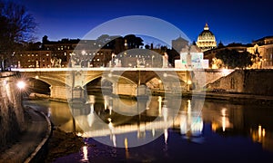 Night view of Tiber and St Peter's Basilica in Rome