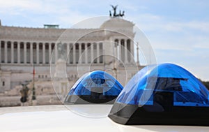 Rome, RM, Italy - August 18, 2020: Blue Sirens of Police and Ancient Monumento called Altare della Patria in Background