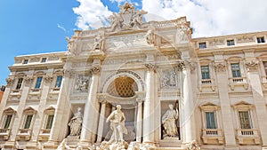 Rome trevi fountain and art statue Fontana di Trevi in Rome, Italy with bright day blue sky. Trevi is most famous fountain of