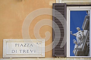 Rome, Trevi Fountain. Reflection of fountain sculptures on the windows