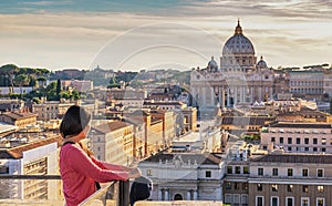 Rome Vatican Italy sunset city skyline with woman tourist