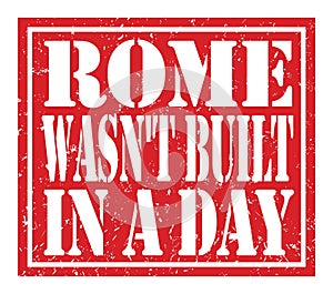 ROME WASN`T BUILT IN A DAY, text written on red stamp sign