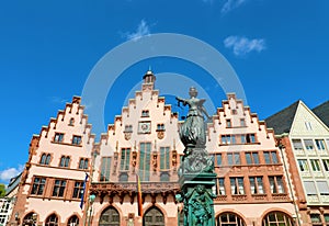 Romerberg square with the city hall and justice statue on blue sky, main landmark of Frankfurt, Germany