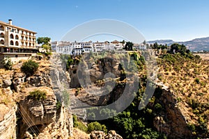 Ronda, Andalusian town situated atop spectacular deep gorge, with traditional white Spanish houses and steep cliffs, Spain