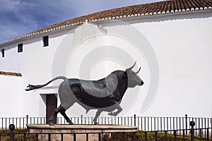 Ronda, Spain, February 2019. Monument to the bull at the main entrance to the circular arena of the Plaza de Toros, Ronda.