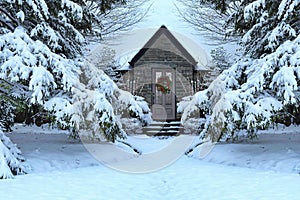 Ront yard of old house with gable, with colorful wreath decoration on front door