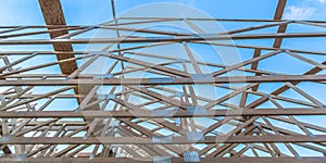 Roof beams of a new wooden construction pano