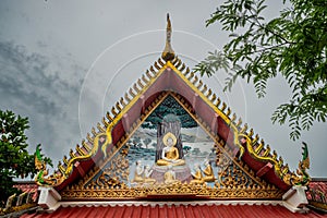 Roof of the beautiful buddhist temple decorated with art. Thailand