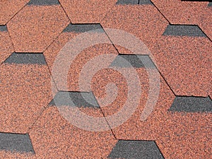 Roof, black and red flexible tiles. Shingle Siding Background. Cedar Shakes Background