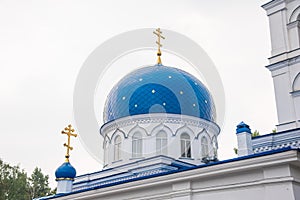 The roof of the Christian Church is made of white stone with blue domes with stars and gold crosses.