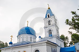 The roof of the Christian Church is made of white stone with blue domes with stars and gold crosses.
