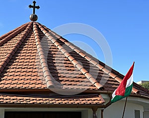 Roof of a church and hungarian national flag