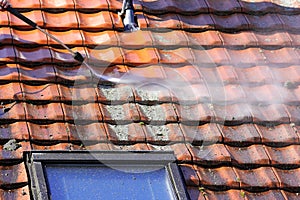 Roof cleaning with high pressure