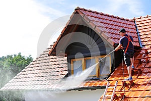 Roof cleaning with high pressure cleaner