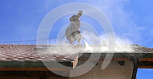Roof cleaning with high pressure cleaner photo