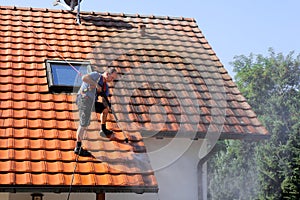 Roof cleaning with high pressure photo
