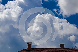 Roof and cloudy sky