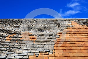 Roof construction site. Removal of old roof, replacement with ne