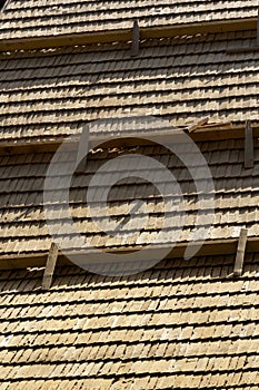 Roof construction site. Removal of old roof, replacement with new shingles, equipment and repair. Roofs are a very important part