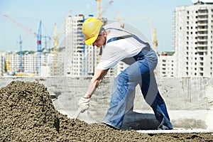 Roof construction. worker roofer leveling with float lute