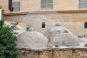 Roof with cupolas of ancient bathhouse hamam in Icheri sheher Old Town of Baku