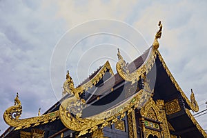 Roof detail of golden Buddha temple in Thailand