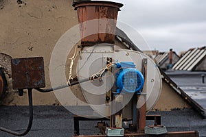 The roof of the factory. There is an external part of a single exhaust system.