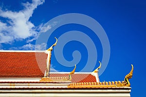 Roof gable in Thai temple with blue sky