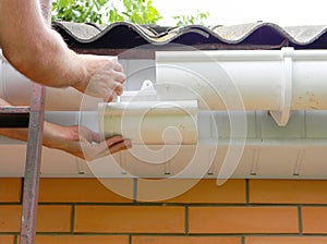 Roof gutter pipe renovation, fix repair on brick house asbestoc roof