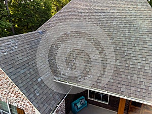 Roof with hail damage and markings from inspection