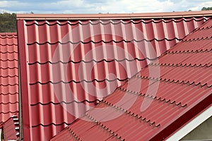 The roof of the house is covered with metal tiles