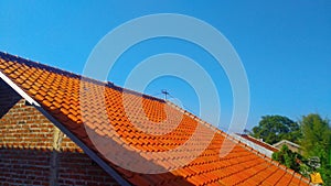 The roof of the house during the day