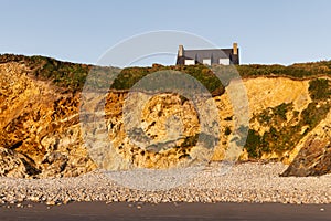 roof of a house over a cliff at the coast of the Crozon peninsula, France