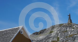 roof of a house and the statue of Hans Egede, Nuuk, Greenland