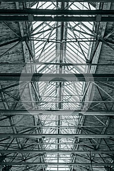 Roof of industrial building. ceiling of factory with steel beams