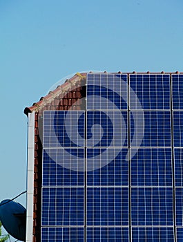 Roof installed solar panel detail under blue sky