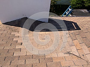 Roof leak repairs and a cricket rebuild on residential shingle roof photo