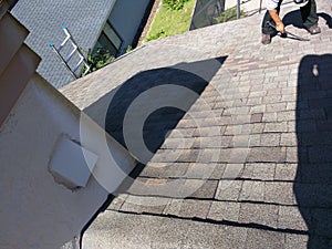 Roof leak repairs on residential shingle in process