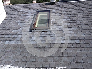 Roof leak repairs and skylight installation on residential shingle roof
