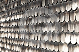 Roof is made of wooden shingles. Background and texture, close-up