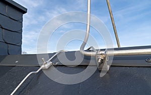 Roof with metal lightning arrester or protection